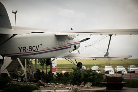 Old airplane with bright sky on background and big propeller
