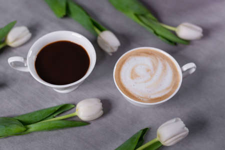 Espresso and cappuccino on the table in white cups. Coffee selection.