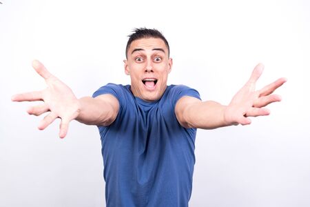 Euphoric man celebrating something. White background. Middle plane