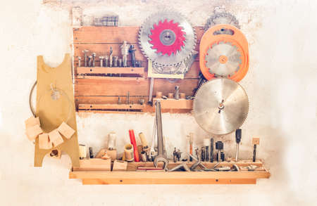 workbench with cutting discs, drills and toolsの写真素材
