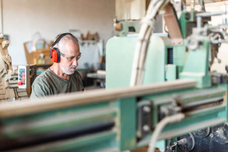 male employee working in an industrial factoryの写真素材