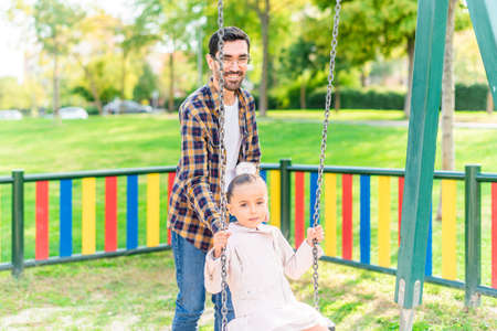 A young man playing with his adopted daughterの写真素材