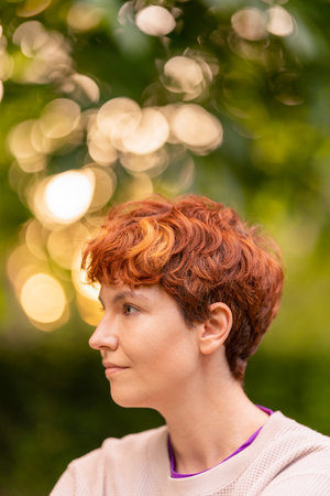 Calm non binary person on summer day in natureの写真素材