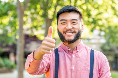Man in casual clothes gesturing being well with the hand