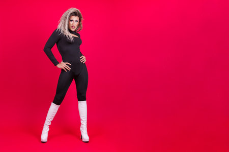 Stylish transgender person posing while looking at the camera