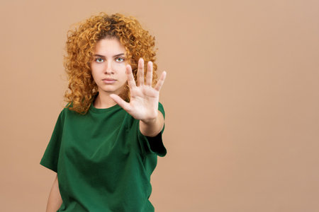 Serious woman gesturing with her hand prohibitionの写真素材
