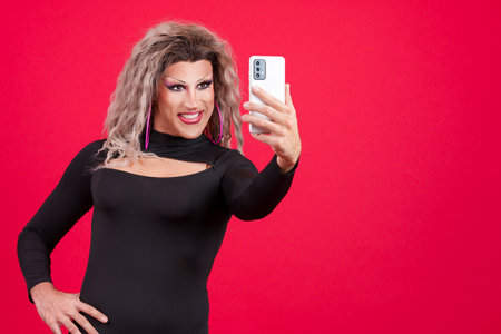 Transgender woman with make up taking a selfie with mobileの写真素材