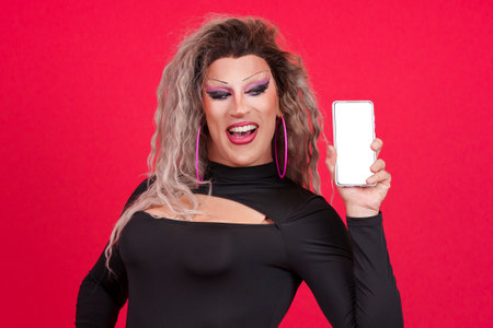 Blank screen of the mobile held by a transgender personの写真素材
