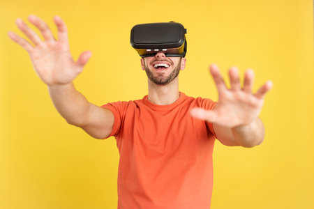 Happy caucasian man with Virtual Reality gogglesの写真素材
