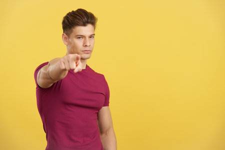 Handsome caucasian man pointing to camera with the fingerの写真素材