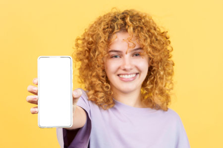 Blank screen of the mobile held by a young womanの写真素材