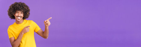 Man gesturing to indicate a blank space to the sideの写真素材