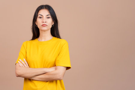 Caucasian woman crossing the arms with an angry expressionの写真素材