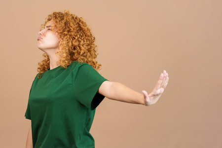 Woman gesturing that she wants to know nothingの写真素材
