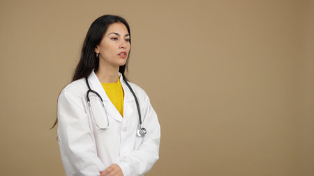 Friendly caucasian female doctor in uniform and stethoscopeの写真素材