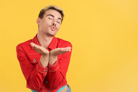 Gay man blowing a kiss to the cameraの写真素材