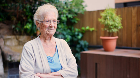 Distracted grandmother looking away outside a nursing home