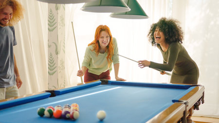 Friends laughing when woman playing awful at poolの写真素材