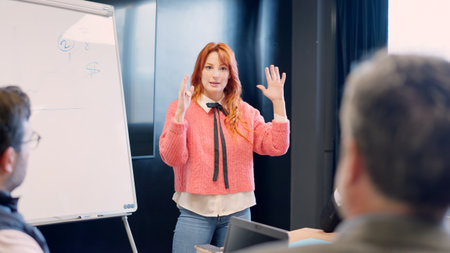 Woman clarifying an idea during a presentation in a meeting