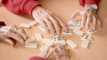 Senior people sorting the domino tiles in a geriatricの写真素材