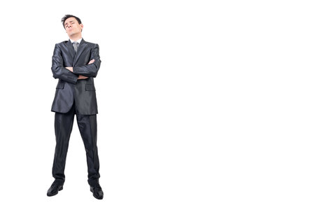 Arrogant man in elegant suit. White background.の写真素材