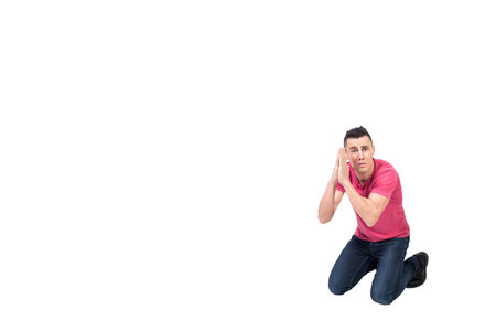 Man kneeling with prayer handsの写真素材