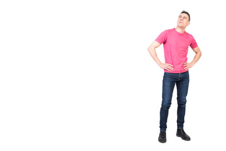 Skeptic man looking up and thinking. White backgroundの写真素材