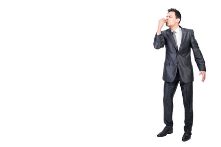 Male manager enjoying a meal. White background.の写真素材
