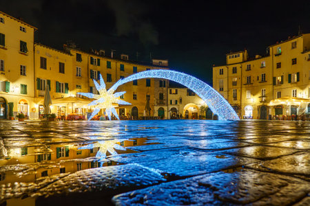 view of the Amphitheatre square in Lucca at nightの写真素材
