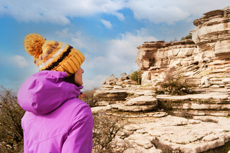 Woman hiker in Torcal de Antequera looking at the landscapeの写真素材