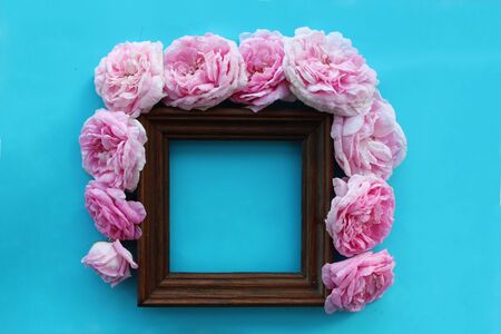 Bright pink summer flowers with brown frameの写真素材