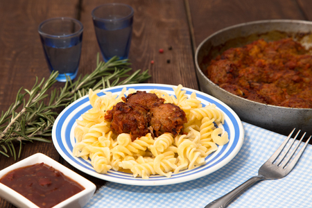 Turkey meatballs in tomato sauce with pastaの写真素材
