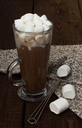 Cup of hot cocoa with marshmallows on the wooden tableの写真素材
