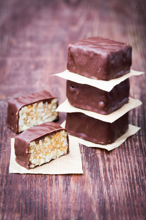 Peanut brittle with chocolate on dark backgroundの写真素材