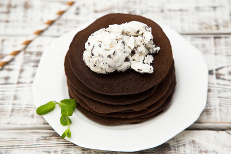 Chocolate pancake with icecream on a light background.の写真素材