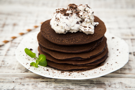 Chocolate pancake with icecream on a light background.の写真素材