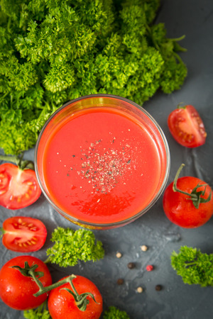 fresh organic tomatoes and tomato juice with parsley. the detox conceptの写真素材