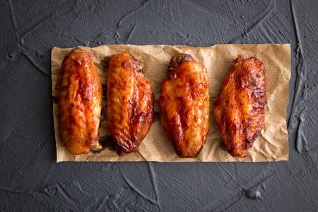 Fried chicken wings on a dark gray backgroundの写真素材