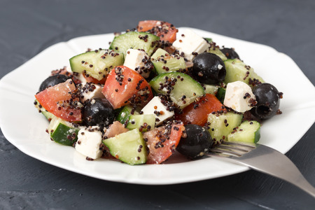 Fresh salad with black quinoa, tomatoes, cucumbers and feta cheese.の写真素材