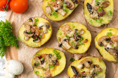 baked potato with mushrooms and bacon with cheeseの写真素材