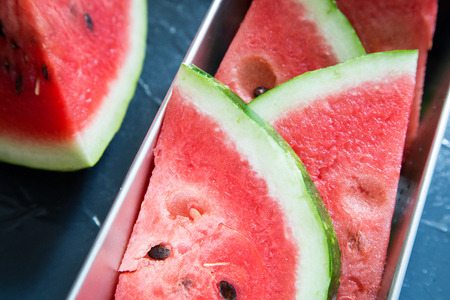 Watermelon slice popsicles on grey background. Selective focus.の写真素材