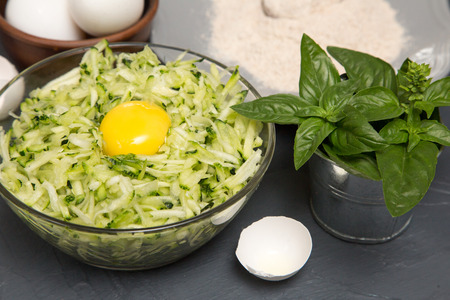 ingredients for zucchini pancakes - zucchini, eggs and flour.の写真素材