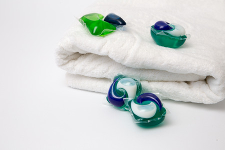 Capsules with laundry detergent on a white backgroundの写真素材