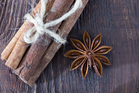 cinnamon and star anise on a wooden background . close-up.の写真素材