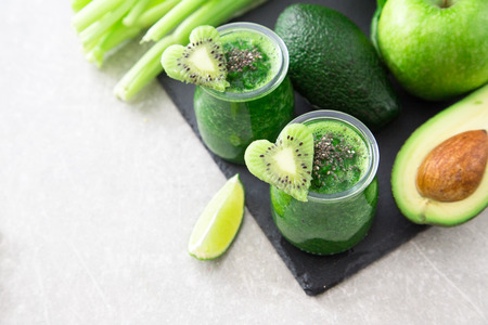 Blended green smoothie with ingredients. Superfood, detox and healthy concept. selective focus .の写真素材