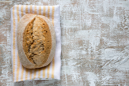 Fresh bread on table. Selective focus. Top view with space for your text