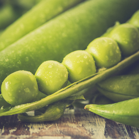 green pea pod, green peas. Vegetable background.の写真素材