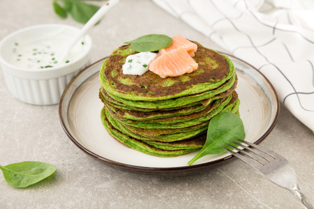 Spinach ricotta pancakes with salted salmon.の写真素材