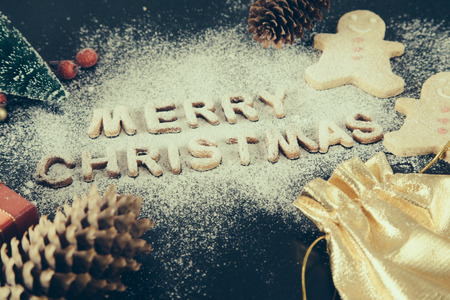 Card with Gingerbread Cookies. Baked Letters Merry Christmas, Fir Tree. Christmas card.の写真素材