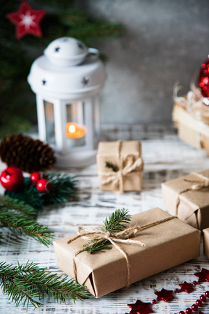 Christmas background. Christmas composition. Christmas gift, pine cones, fir branches on wooden white backgroundの写真素材